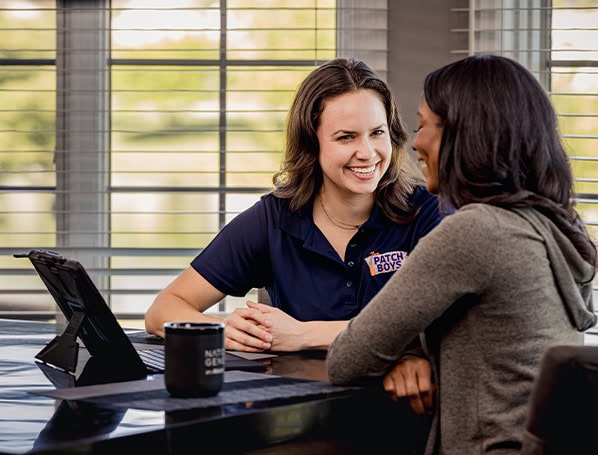 Technician talking to customer