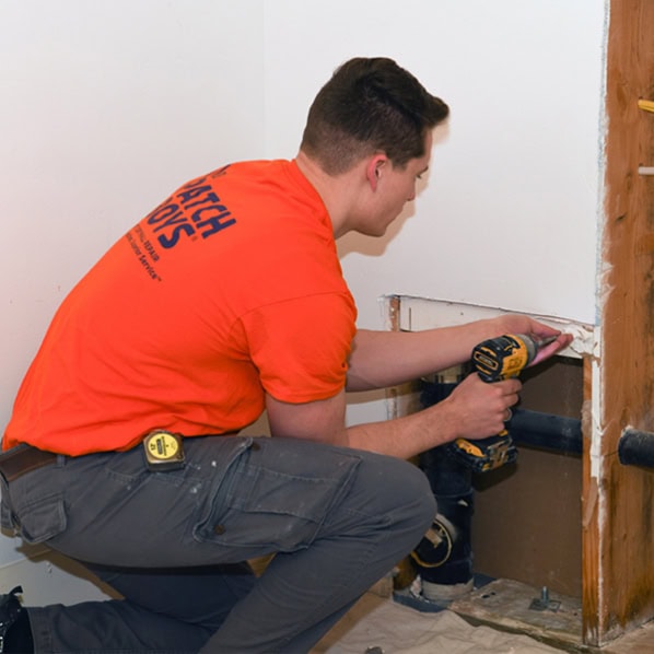 Patch Boys worker fixing drywall