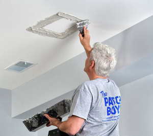 Man repairing ceiling