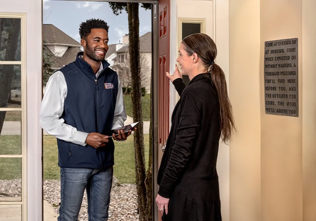 Worker talking to customer
