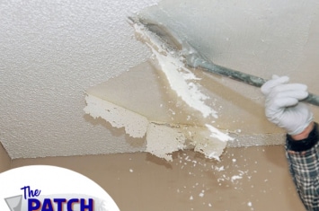 Hand holding tool and removing a popcorn ceiling
