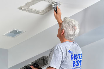 Man repairing ceiling