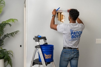 Man repairing drywall