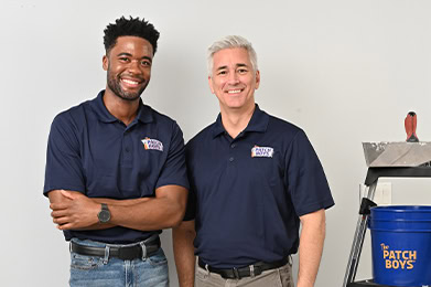 Two technicians standing next to eachother